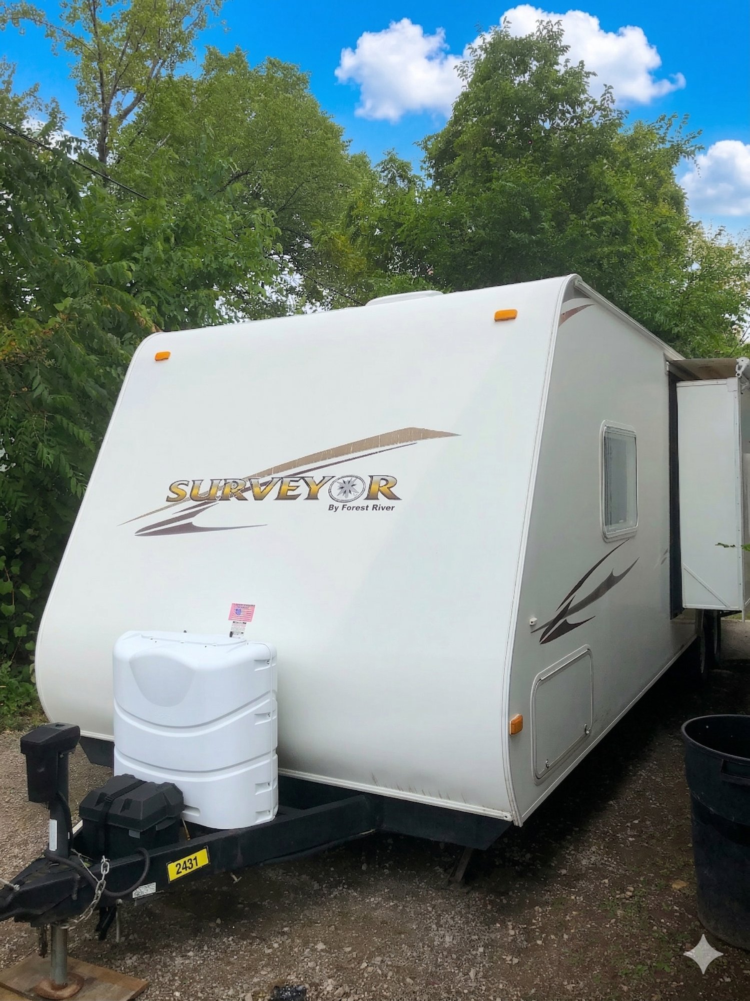 Forest River Surveyor travel trailer purchased by Straight Deal RV